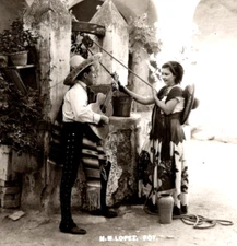 Man with Guitar Serenading Woman at Well Mexico 1950s RPPC Postcard