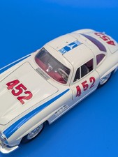 MERCEDES - BENZ 300 SL, 1954 BURAGO 1: 18 SCALE TIN CAR White Blue