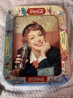 Vintage Coca-Cola lithographed metal serving tray with a 1950s woman.