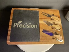 wooden serving board with an inset slate slab for serving cheese or charcuterie