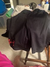 Under armor boys size youth small black and red shorts with drawstring