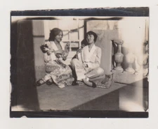 Two Beautiful Young Women from the 1920s Relaxed with Cigarettes Closeness Photo