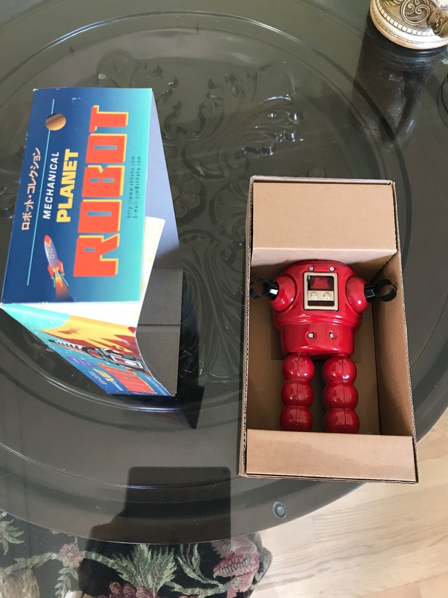 Forbidden Planet's mechanical Robby Robot with box and wind-up key