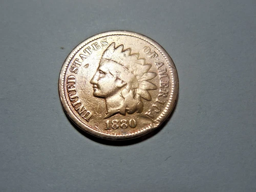 1880 Indian Head Cent in good condition. Has a gash but still good coin.