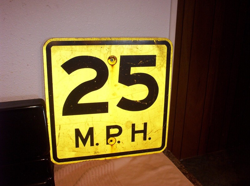 RETIRED 25 M. P. H. SIGN