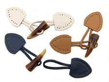 ALAMARO BOTTONE UNISEX IN ECOPELLE CON CORNO IN RESINA 