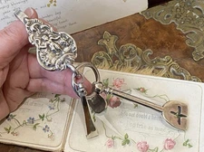 Antique continental hallmark sterling silver embossed  cherub chatelaine hook