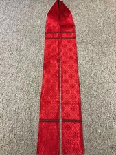 Red clergy stole with cross design and red galloon.