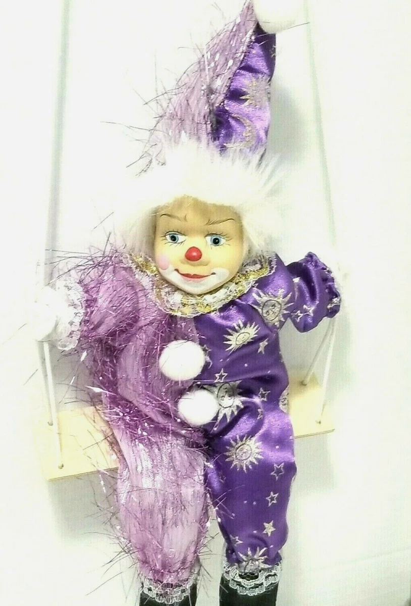 Porcelain clown doll on swing hotsell