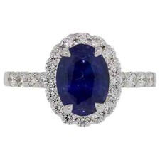 Simulated Oval Blue 2.50CT Sapphire With Round White CZ Halo Simple Women's Ring