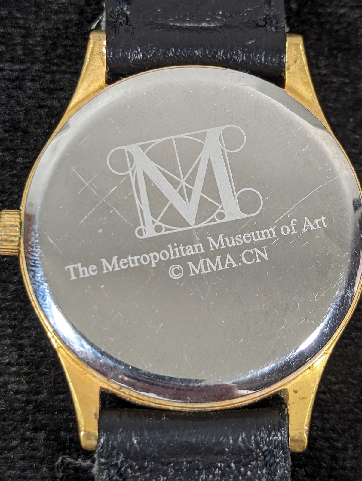 The Metropolitan Musuem Of Art MMA Purple Dial Gold Tone Case Black Band Watch