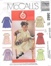 McCall's Sewing Pattern 3882 Children's and Girls Dresses In Six Versions Size 3