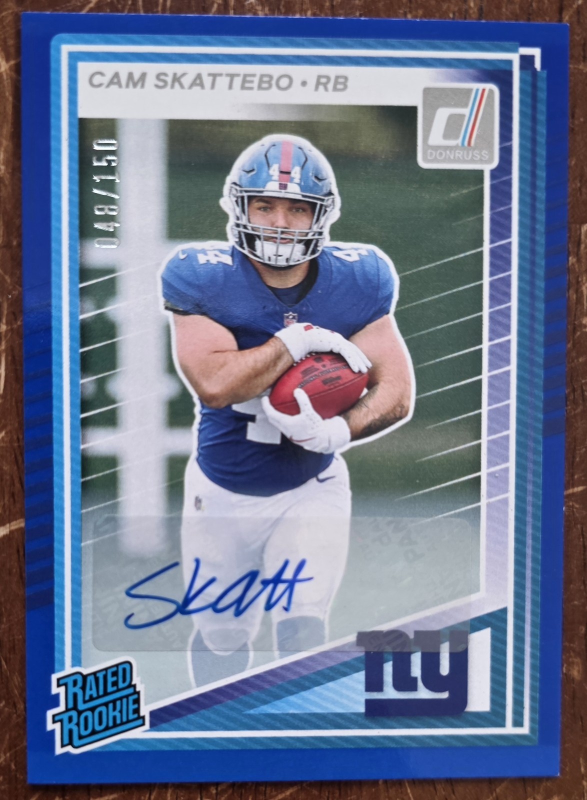 2025 Panini Donruss Rated Rookie Cam Skattebo: Blue  Auto /150