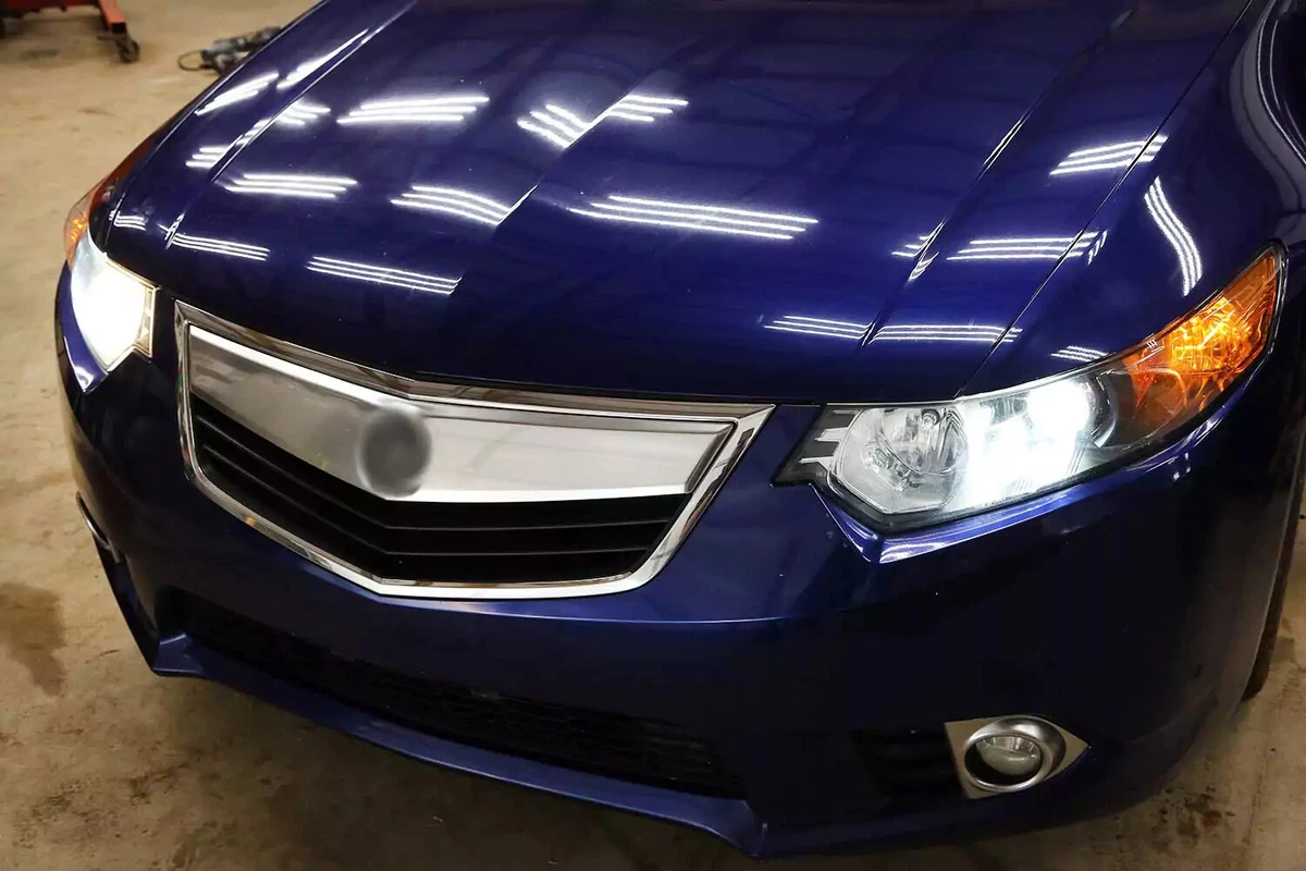 Wagon with a faulty high beam headlight that needs to be replaced.