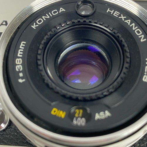 Konica C35 fotocamera pellicola argento 35 mm manuale esposizione automatica obiettivo esagano - Foto 9 di 13