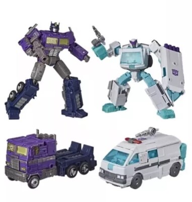 Transformers Generations Selects Shattered Glass Optimus Prime & Ratchet in hand