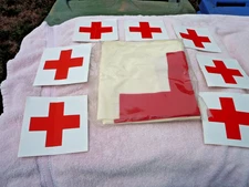 NOS RED CROSS FLAG IN UNOPENED PLASTIC & ORIGINAL BOX AND 7 RED CROSS STICKERS