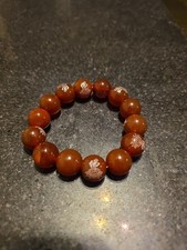 Beautiful Red agate beaded bracelet featuring the Chinese character Buddha