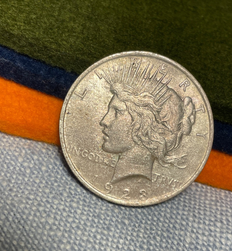 (#100748)  Peace Dollar:  1923.  bu. old envelope toning     (see video!)