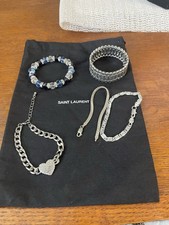 Bundle of 5 bracelets & a Saint Laurent dust bag, 2 bracelets are stamped 925,