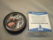 Chris Osgood Signed Red Wings Stanley Cup Champs Hockey Puck Beckett BAS COA 1A 