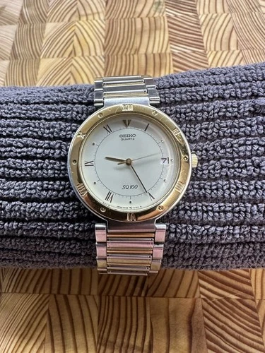 Vintage Seiko SQ 100 5H22-6189 Men’s Quartz Gold Plated/Steel Date Wristwatch
