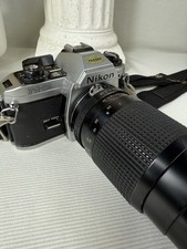 Nikon FG-20 35 MM Film SLR camera body Sears 300 mm Zoom lens untested