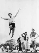 British athlete Mary Bignal is watched by a group unspecified peop- Old Photo