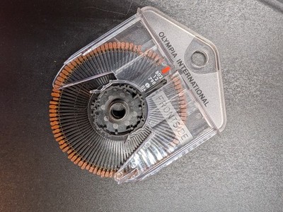 OLYMPIA INTERNATIONAL ORIGINAL TYPEWHEEL TYPEWRITER WHISPER DISC 802 12 798 04