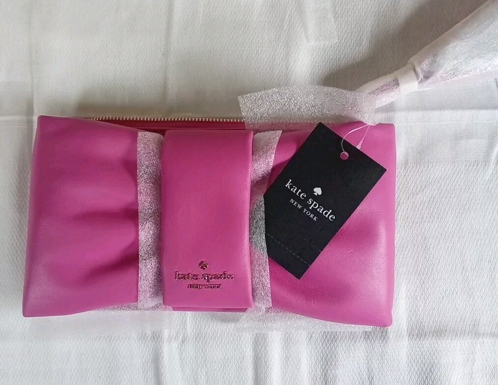 Kate Spade Millie Bow Medium Wristlet In The Color Magenta