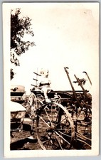 Vtg B&W Snapshot Baby Toddler Sitting On Farm Plow Large Spoked Wheels 1940s