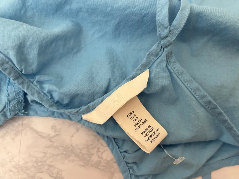 Top sin mangas con correa de espagueti H&M talla S túnica azul cuello en V corbata para el hombro Y1 Foto 3 de 3