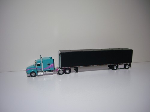 DCP FIRST GEAR 1/64 TEAL PETE 579 WITH SLEEPER AND SIMULATED ROLL TARP TRAILER - Picture 2 of 12