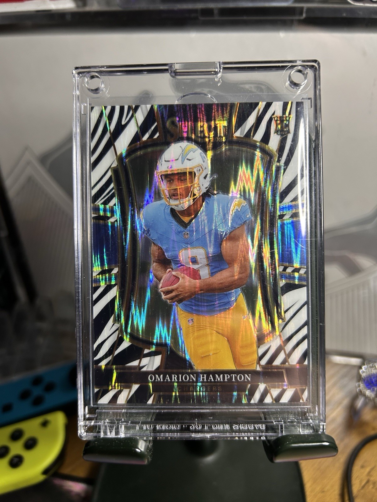 2025 NFL Select - Omarion Hampton - 102- Zebra Prizm Shock