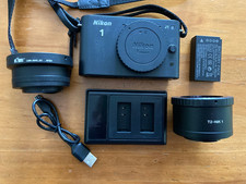 Nikon 1 J1 Camera Body with Charger, and Battery + T2 and M42 Lens Adapters