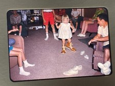 1962 35mm Color Film Slide Child Wearing Daddys Work Boot Room Littered W/ Shoes