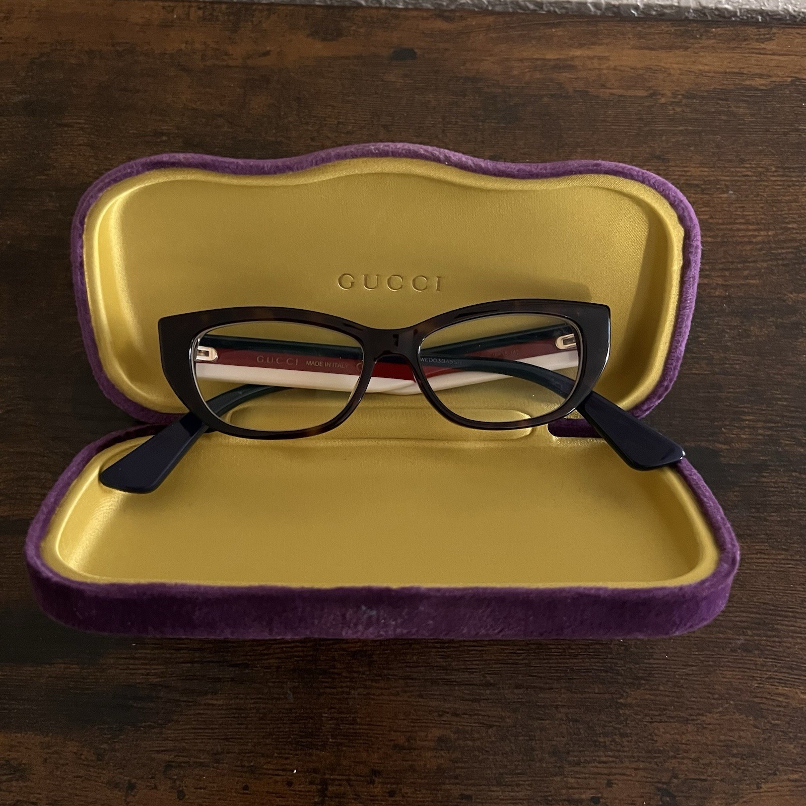 GUCCI GG0277O Cat-Eye Eyeglasses With A Shiny Black Acetate Frame Made In Italy