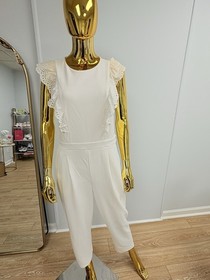 Ruffled Sleeveless White Jumpsuit with Lace Trim