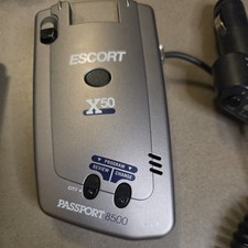 Escort Passport 8500 X50 Radar Detector Blue dash Silver case with car adapter.