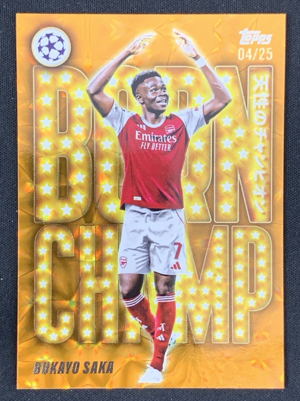 Bukayo Saka 2025-26 Topps UCC Japan Edition Born Champ Orange Foil /25 #BC-1