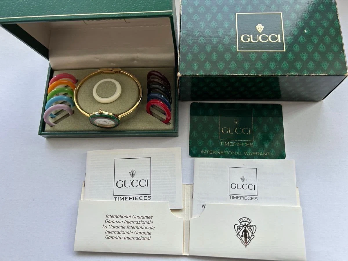 Montre femme neuve Gucci lunette changeante 12 couleurs blanc/or placage quartz 0818126