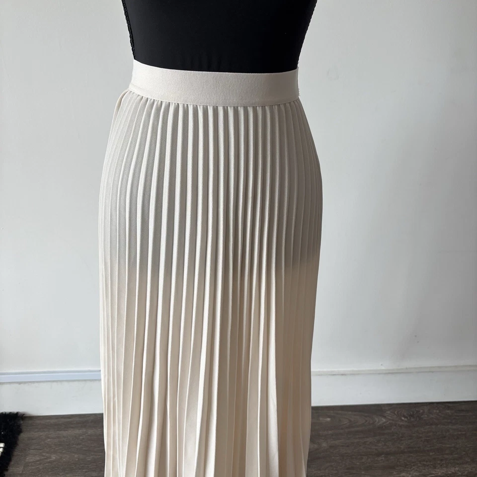 Falda midi plisada beige semi transparente talla XS cápsula neutral H&M para mujer Foto 3 de 4