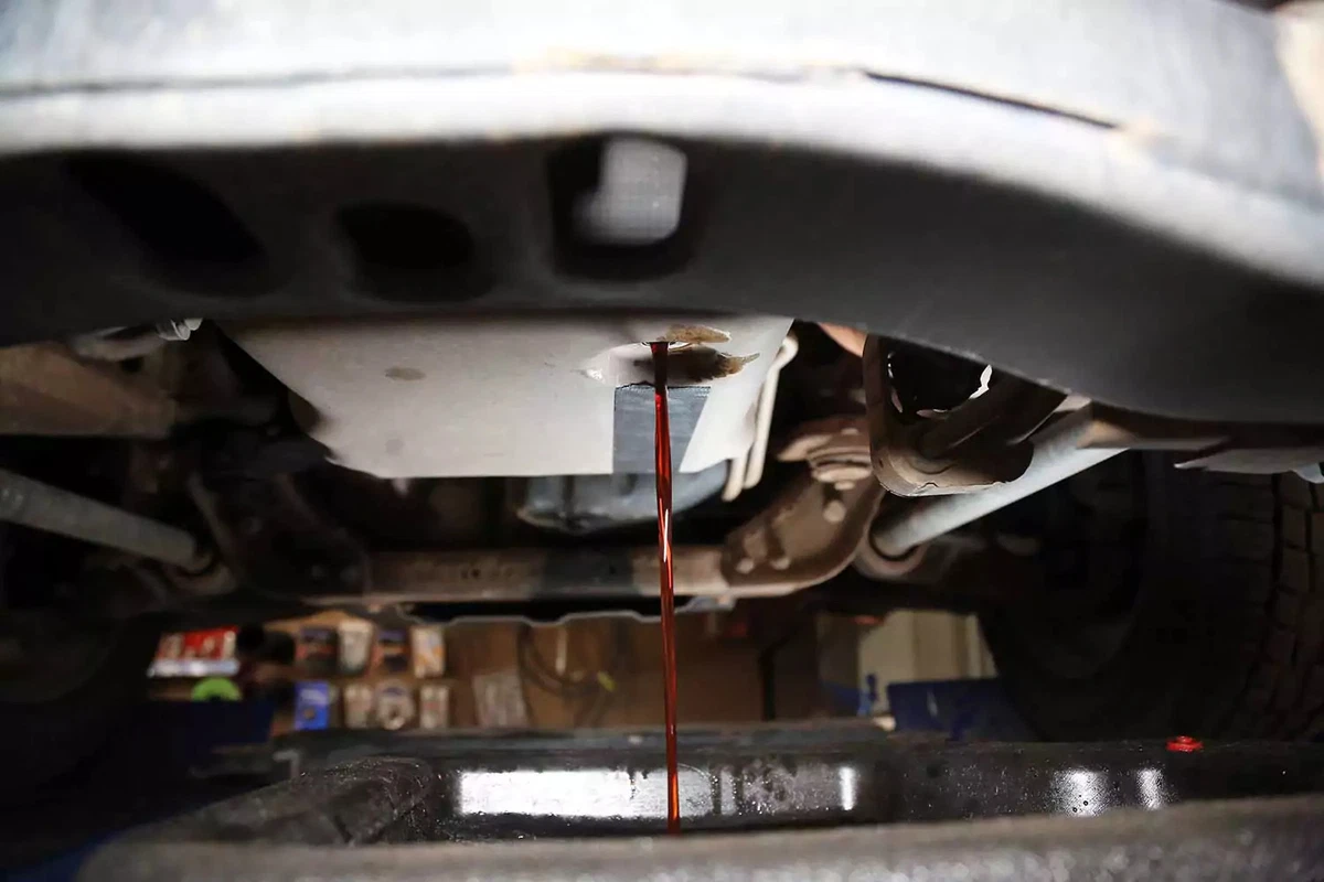 Automatic transmission fluid drains from the pan.