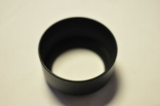 Plastic 55mm thread lens hood for a normal to short telephoto lens.