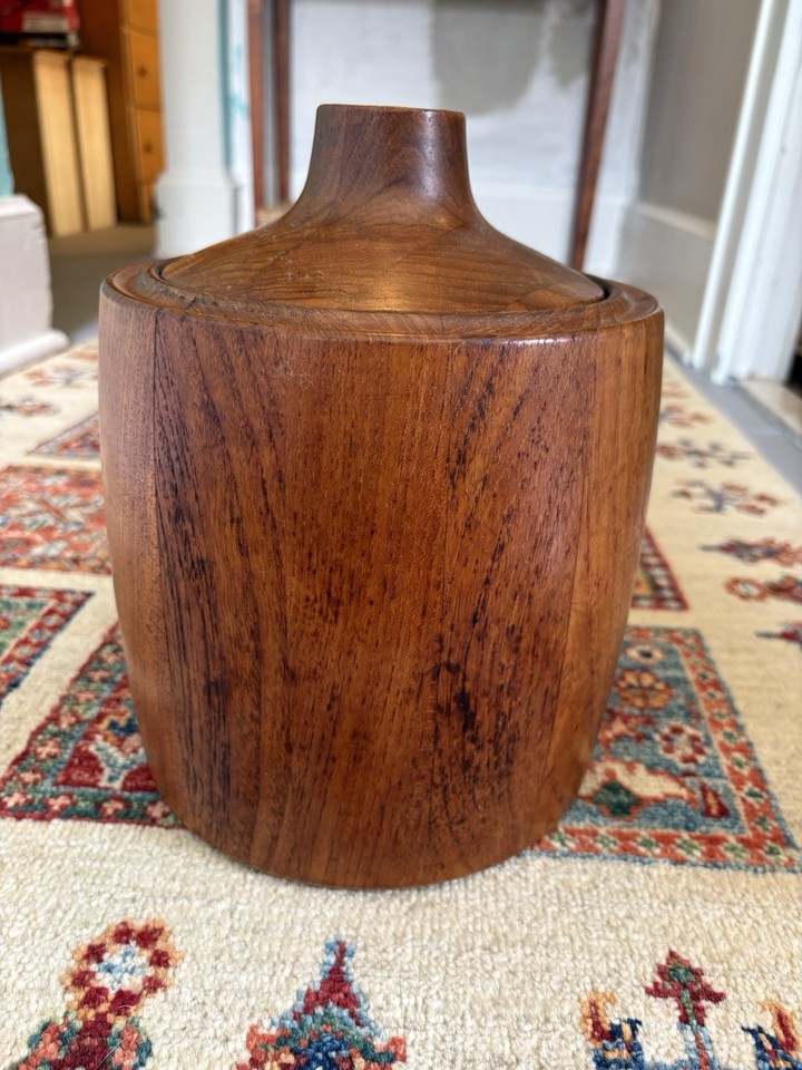 A Henning Koppel-designed Georg Jensen teak ice bucket from Denmark — a genuine piece of Scandinavian design history that doubles as functional barware.