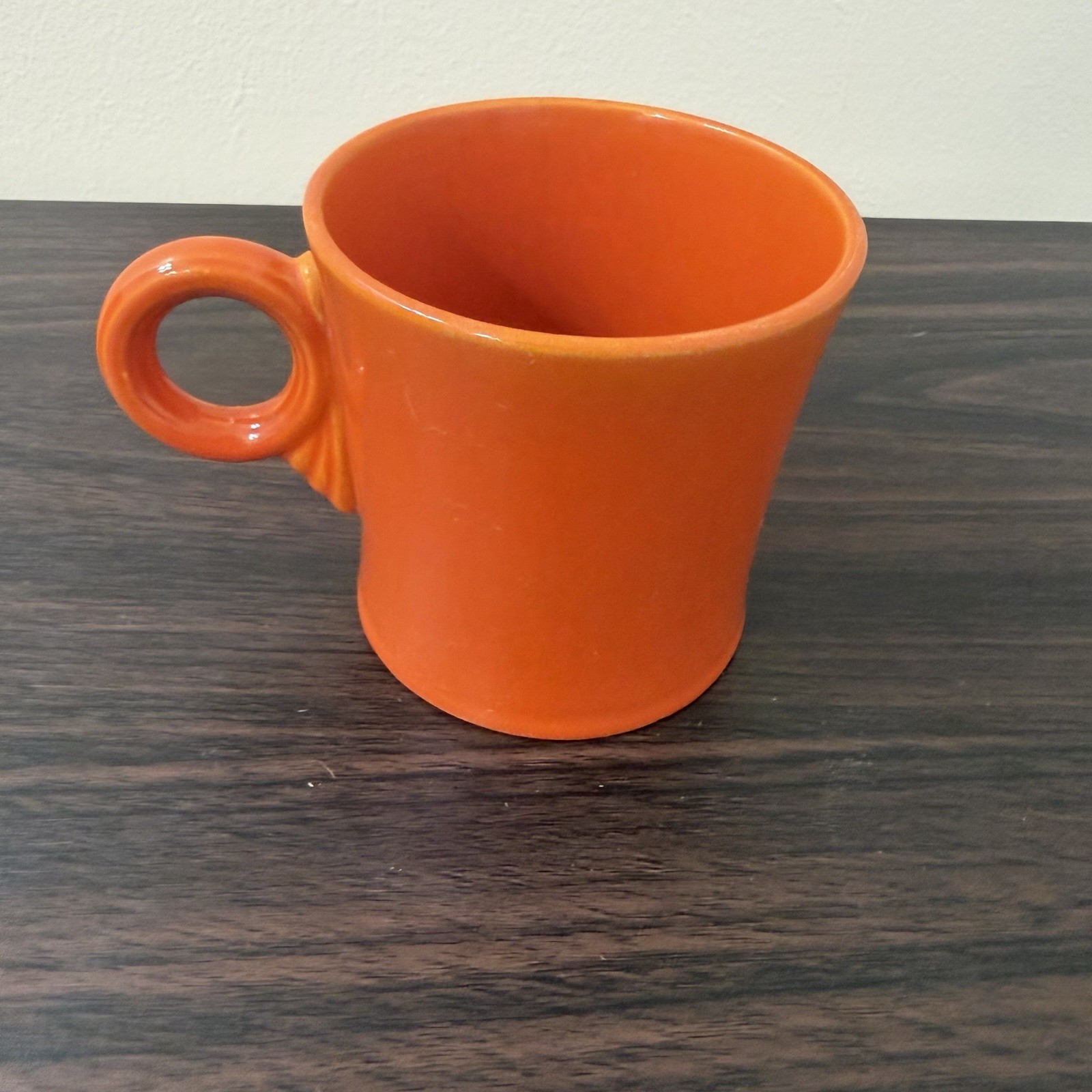 Red Fiesta ceramic mug with circular ring handle