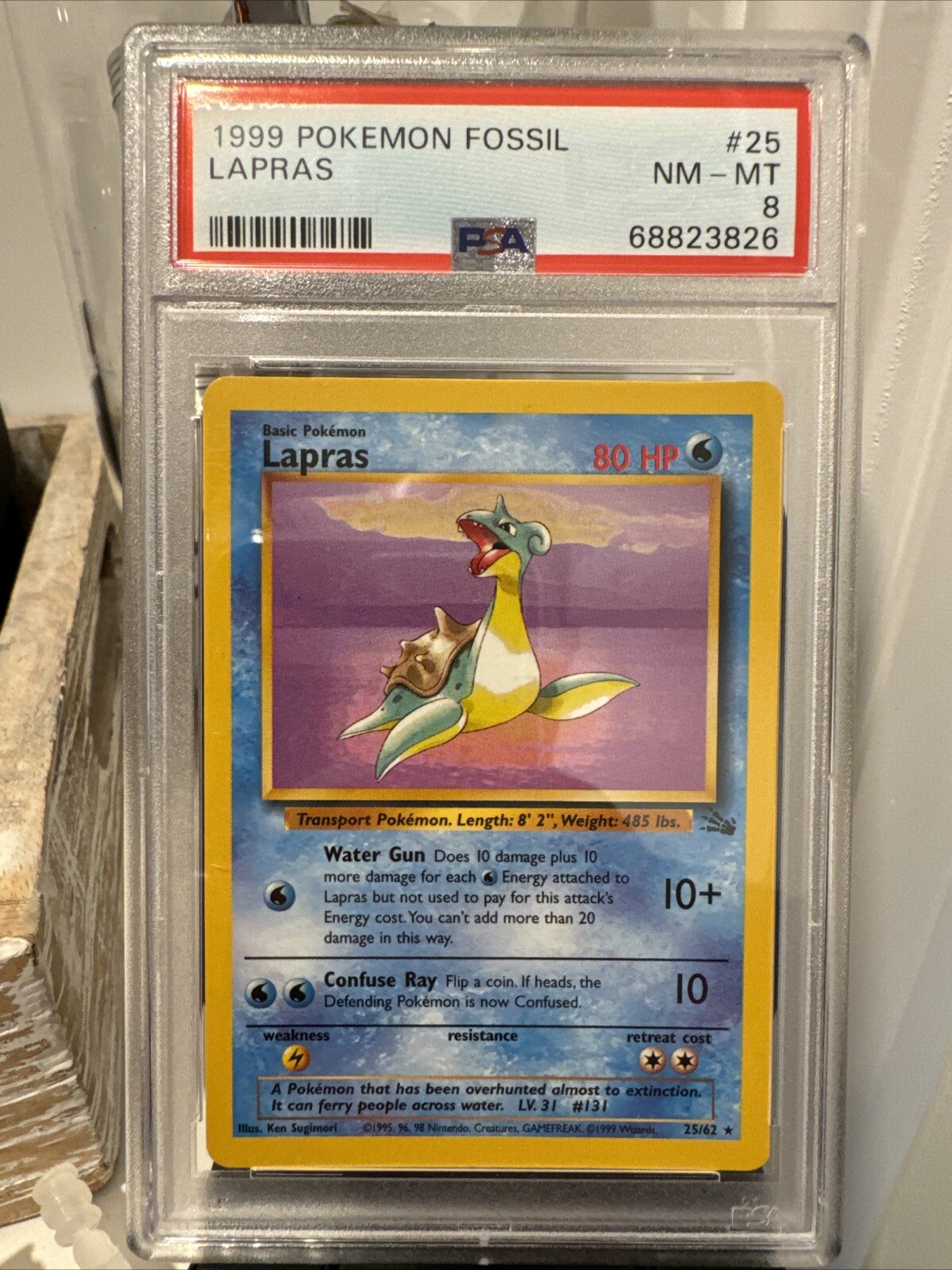 1999 Pokemon Fossil Lapras Unlimited Holo #10/62 PSA 8 NM-MINT