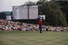 American golfer George Archer checks scoreboard before going 18th - Old Photo
