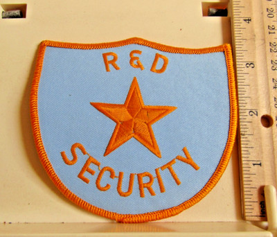 R & D Security patch NOS new pale blue yellow unknown state
