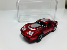 AFX tras CANDY RED  CORVETTE AW Chassis  Display case Aurora NEW 